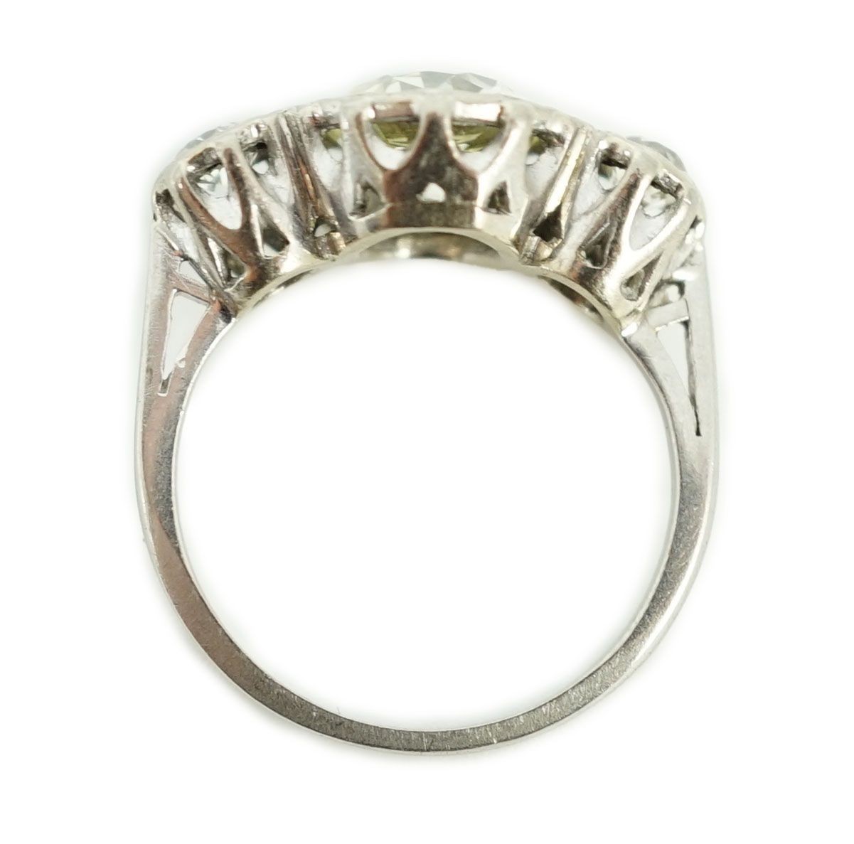A white gold and collet set three stone diamond ring, the central stone weight approximately 2.08ct